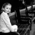 Portrait of a girl on a bench in Holland Park