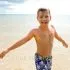 Portrait of a sandy boy enjoying the beach
